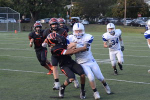 Eric Segura tackles Sam Giachinta in a 2017 meeting between Tuckahoe and Haldane. The Blue Devils and Tigers will square off on Nov. 3 for the Class D title.