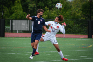 Carlo Ricchiuti sends a ball back down the field on Oct. 13. Eastchester coach Darwin Gramajo was impressed with Ricchiuti’s play against a potent White Plains attack.  Photo/Mike Smith