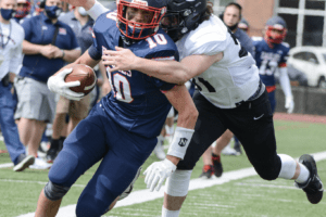 Rye's Ryan Surhoff chases down Eastchester's Mark Tamburro on April 10. Rye beat Eastchester 28-7