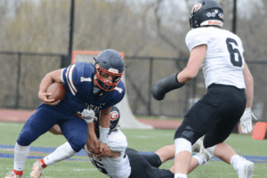 Eastchester’s football team plays against Rye in 2021. Over the last 12 weeks, Eagles’ assistant coach Tony Panio has been hosting YouTube watch parties for some of the biggest moments in the program’s history. Photo/Mike Smith