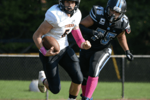 Michael Annunziata runs for positive yardage against Rye Neck on Oct. 16, 2021. The Tigers topped the Panthers 52-7. Photo/Mike Smith