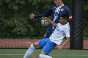 Carlo Ricchiuti battles for the ball with a Saunders defender on Oct. 23, 2021. Ricchiuti broke a scoreless tie with a goal in the second half.