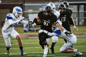 Michael Meyers rushes for positive yardage against Haldane in the Class D championship game on Nov. 12, 2021. Meyers rushed for 352 yards and three touchdowns to lead Tuckahoe to a 48-40 win. Photo/Mike Smith