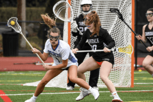 Molly Krestinski controls the ball in the offensive zone against Scarsdale on March 24. Photo/Mike Smith
