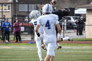 Jax Colaccico makes a one-handed interception against the Blue Devils. Tuckahoe will play Moriah on Nov. 18.