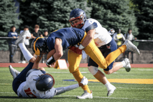 Eastchester defenders converge on a Pelicans ballcarrier on Sept. 15, 2023