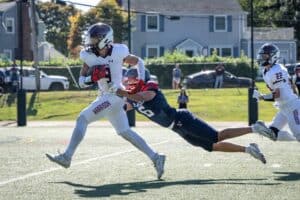 Jason Crupi sheds a tackle en route to a 2nd half touchdown against Eastchester on Sept. 20. The Huskies topped the Eagles 28-22.